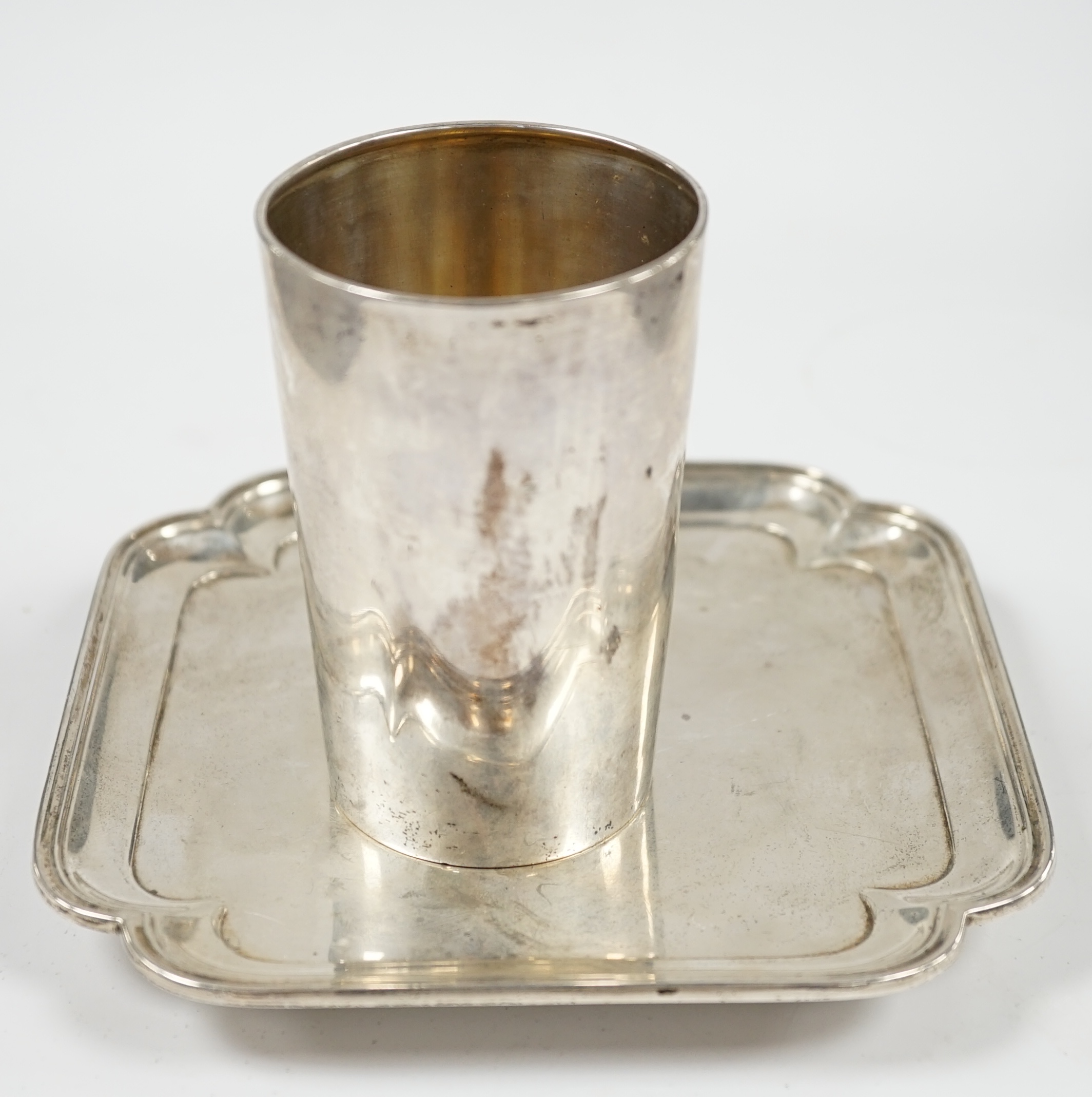A Victorian silver beaker, Martin, Hall & Co, Sheffield, 1888, 91mm and a George V silver waiter, 9.5oz. Condition - fair